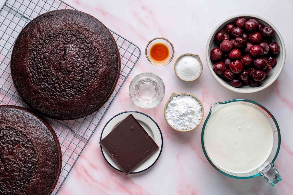 a image of black forest cake making ingredients.