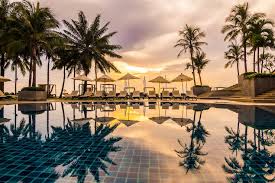 A beautiful place of marg krishnaaya resort in vijayawada with coconut trees view in sunset