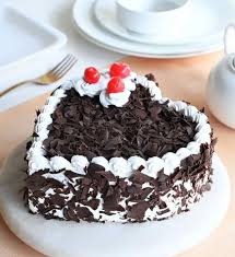 a image of black forest cake making in a perfect manner